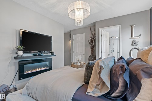 16507 81 Street, Edmonton, AB - Indoor Photo Showing Bedroom With Fireplace
