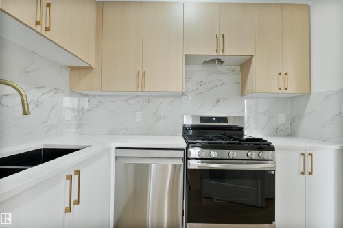 603 Ashgrove Circle, Leduc, AB - Indoor Photo Showing Kitchen With Double Sink