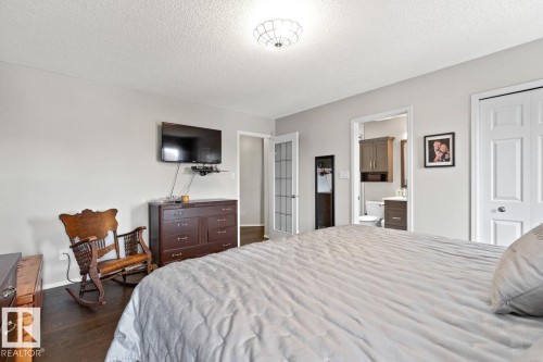 Master Bedroom With Walk-In Closet That Has A Wall Safe. - 12824 157 Avenue, Edmonton, AB - Indoor Photo Showing Bedroom