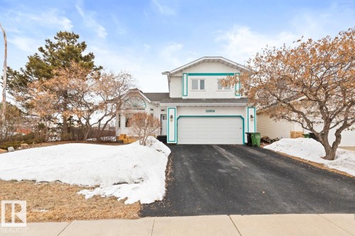 Front Of The House With Rubber Top Driveway To Attached Double Garage. - 12824 157 Avenue, Edmonton, AB - Outdoor