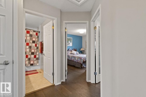 View From Hallway Into Bathroom & Two Bedroom Doors On The Upper Floor. - 12824 157 Avenue, Edmonton, AB - Indoor