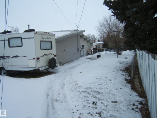The property features a white stucco exterior and a sloped roof - 4702 52 Avenue, Two Hills, AB - Outdoor