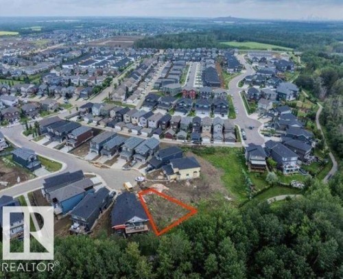 An aerial view showcasing the neighborhood with residential properties and green spaces - 1127 Gyrfalcon Crescent, Edmonton, AB - Outdoor With View