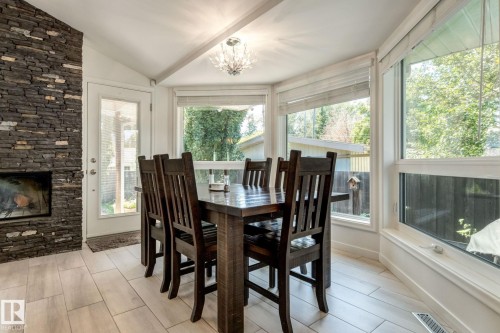 9728 141 Street, Edmonton, AB - Indoor Photo Showing Dining Room With Fireplace