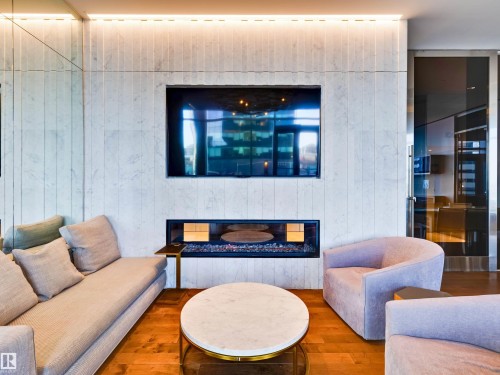 5th floor common area - 2612 10360 102 Street, Edmonton, AB - Indoor Photo Showing Living Room With Fireplace