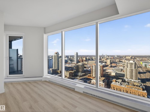 This property features expansive floor-to-ceiling windows providing extensive views of the city - 2612 10360 102 Street, Edmonton, AB - Indoor