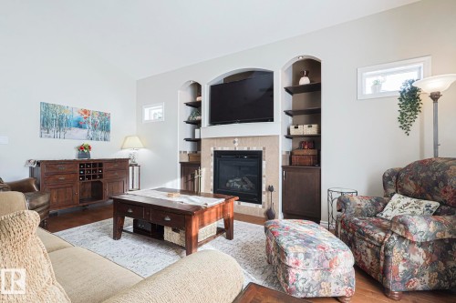 5601 Rue Eaglemont, Beaumont, AB - Indoor Photo Showing Living Room With Fireplace