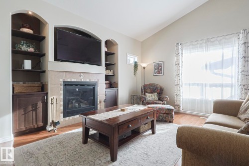 5601 Rue Eaglemont, Beaumont, AB - Indoor Photo Showing Living Room With Fireplace