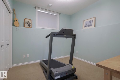 5601 Rue Eaglemont, Beaumont, AB - Indoor Photo Showing Gym Room