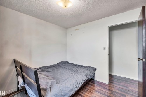 The room features wood-style flooring and a light-colored ceiling - 18923 86A Avenue, Edmonton, AB - Indoor Photo Showing Bedroom
