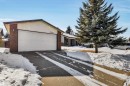The property features a brick exterior with white siding accents and an attached garage with a white garage door - 18923 86A Avenue, Edmonton, AB  - Outdoor 