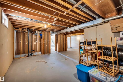 The unfinished basement features exposed wooden joists, a concrete floor, and framed partition walls - 18923 86A Avenue, Edmonton, AB - Indoor Photo Showing Basement
