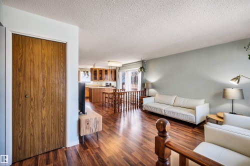 This living space features rich wood flooring and light-colored walls - 18923 86A Avenue, Edmonton, AB - Indoor Photo Showing Living Room