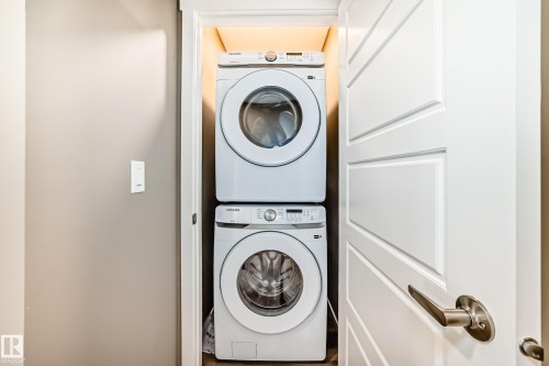 Stackable washer and dryer unit within a dedicated closet - 20415 16 Avenue, Edmonton, AB 