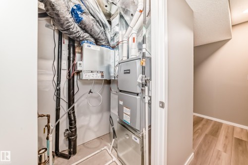 Utility closet featuring a central air handler and furnace system, insulated ductwork, and PVC piping - 20415 16 Avenue, Edmonton, AB 