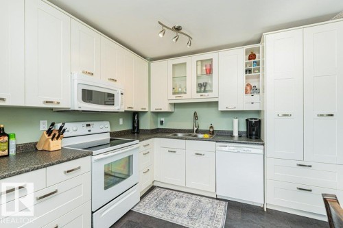 14678 54 Street, Edmonton, AB - Indoor Photo Showing Kitchen With Double Sink