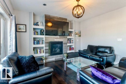 4452 6 Street, Edmonton, AB - Indoor Photo Showing Living Room With Fireplace