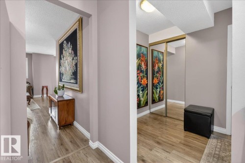 The property features light wood flooring and neutral-toned walls throughout - 3240 130A Avenue, Edmonton, AB - Indoor Photo Showing Other Room