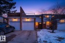 The property features a brick and siding exterior, private balconies, and attached garages - 3240 130A Avenue, Edmonton, AB  - Outdoor With Balcony 