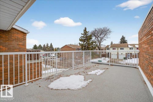 Spacious balcony featuring a white railing and a textured floor - 3240 130A Avenue, Edmonton, AB - Outdoor With Exterior