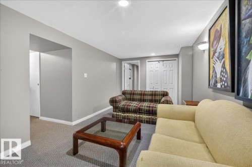 Living area with carpeted flooring and recessed lighting - 3240 130A Avenue, Edmonton, AB - Indoor Photo Showing Living Room