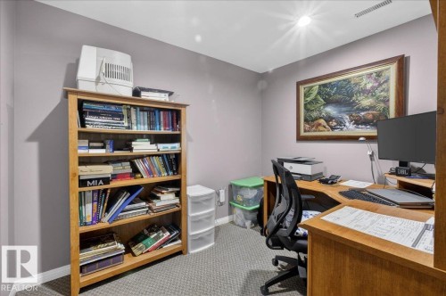 This room features light grey walls and grey carpet flooring - 3240 130A Avenue, Edmonton, AB - Indoor Photo Showing Office