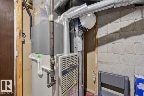 This property includes a furnace with visible ductwork - 3240 130A Avenue, Edmonton, AB - Indoor Photo Showing Basement