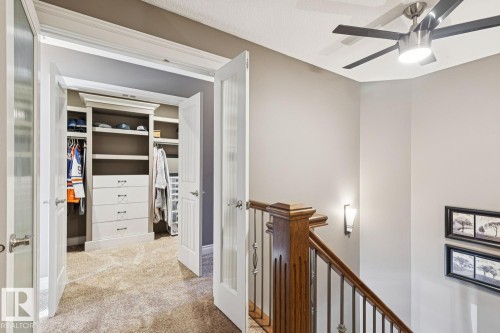 Custom closet with built-in shelving and drawers, providing ample storage - 11409 63 Street Nw, Edmonton, AB - Indoor Photo Showing Other Room