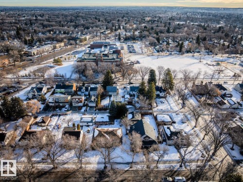This aerial view showcases a residential area with a variety of homes, many featuring sloped roofs - 11409 63 Street Nw, Edmonton, AB - Outdoor With View