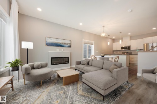 Virtually Staged - 2 12014 92 Street, Edmonton, AB - Indoor Photo Showing Living Room With Fireplace