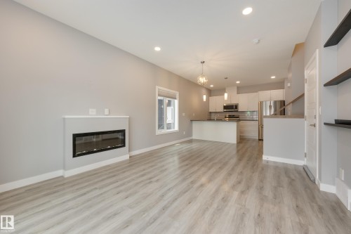 2 12014 92 Street, Edmonton, AB - Indoor Photo Showing Living Room With Fireplace