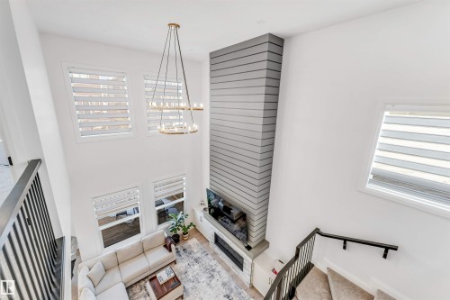 6464 Elston Loop, Edmonton, AB - Indoor Photo Showing Other Room With Fireplace