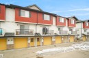 The property features a multi-level design with red and white siding and a dark roof - 13 3751 12 Street, Edmonton, AB  - Outdoor 