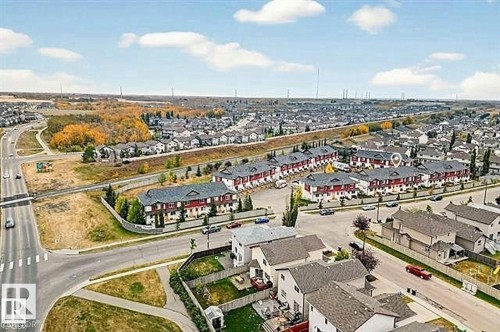 Aerial view showcasing the residential community with clear roads and green spaces - 13 3751 12 Street, Edmonton, AB - Outdoor With View
