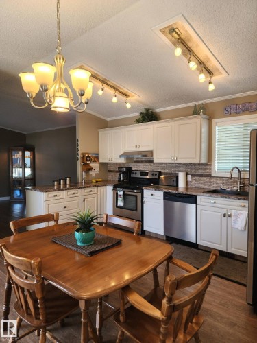 This closet features wire shelving and a single wooden shelf, providing various storage options - 46 Willow Park Estates, Leduc, AB - Indoor With Storage