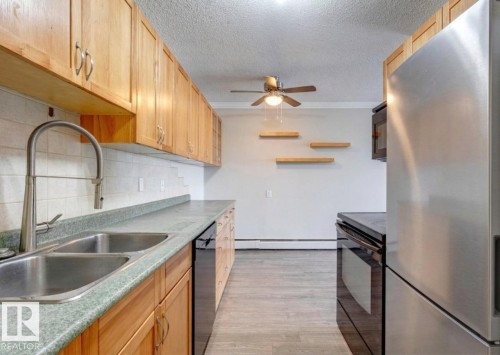 402 10330 113 Street, Edmonton, AB - Indoor Photo Showing Kitchen With Double Sink