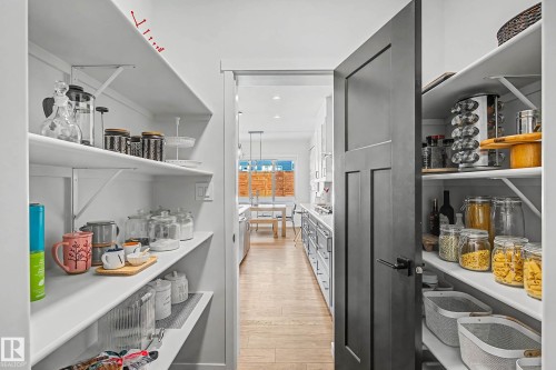 The property features a well-organized pantry with extensive shelving, providing ample storage space - 34 Riverhill Crescent, St. Albert, AB - Indoor