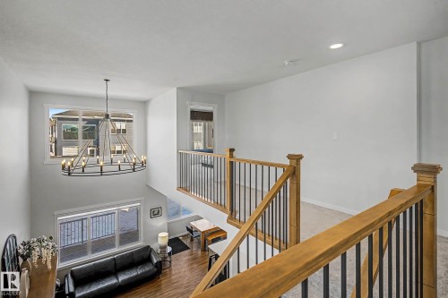 The property features a spacious interior with light-colored walls and large windows - 34 Riverhill Crescent, St. Albert, AB - Indoor Photo Showing Other Room