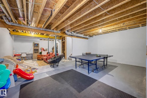 The property features an unfinished basement with exposed wood beams and white walls, offering versatile space - 34 Riverhill Crescent, St. Albert, AB - Indoor Photo Showing Basement
