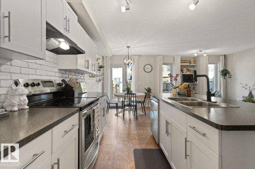 3124 16 Avenue, Edmonton, AB - Indoor Photo Showing Kitchen With Double Sink