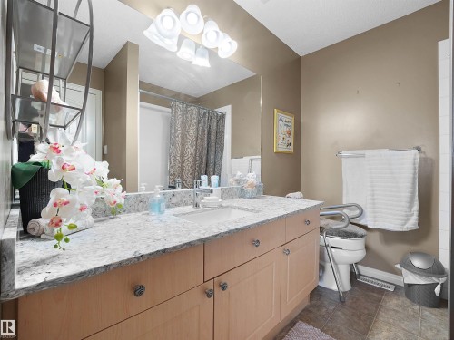 Full bathroom with vanity and curtained shower - 11708 10 Avenue, Edmonton, AB - Indoor Photo Showing Bathroom