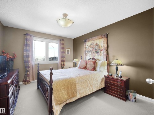 Bedroom with baseboards and carpet floors - 11708 10 Avenue, Edmonton, AB - Indoor Photo Showing Bedroom