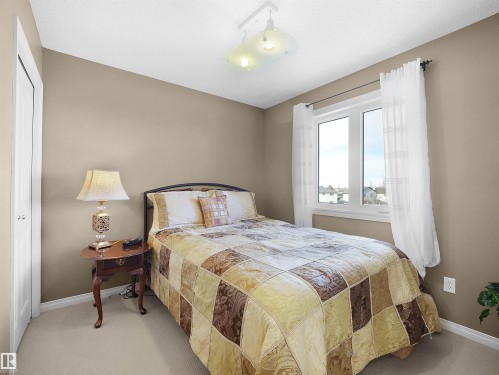 Bedroom with carpet floors - 11708 10 Avenue, Edmonton, AB - Indoor Photo Showing Bedroom