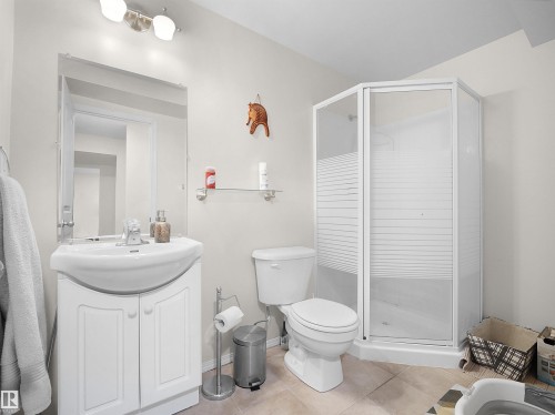 Full bathroom with vanity, a shower stall, light tile patterned floors, and a bidet - 11708 10 Avenue, Edmonton, AB - Indoor Photo Showing Bathroom