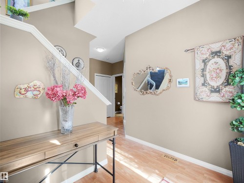 Corridor with baseboards and light wood-style floors - 11708 10 Avenue, Edmonton, AB - Indoor Photo Showing Other Room