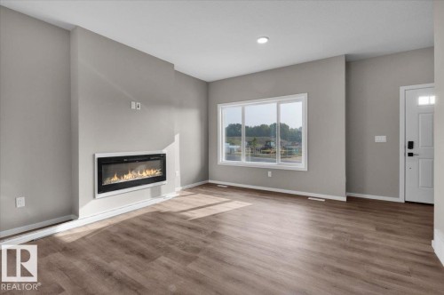 1100 Mcleod Avenue, Spruce Grove, AB - Indoor Photo Showing Living Room With Fireplace