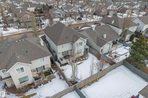 Aerial view of the property and surrounding neighborhood, featuring a backyard with a deck and a fenced perimeter - 1014 Hope Road, Edmonton, AB - Outdoor