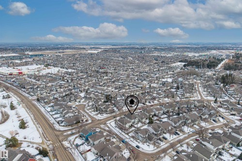 Aerial view of the surrounding residential neighborhood with a network of roads and houses featuring gray roofs - 1014 Hope Road, Edmonton, AB - Outdoor With View