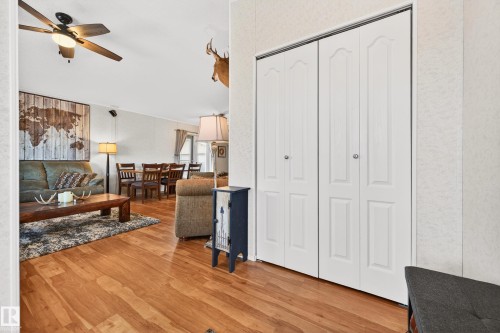 This inviting interior features light wood flooring and white walls, creating a bright and airy atmosphere - 1727 Jubilee Loop, Sherwood Park, AB - Indoor