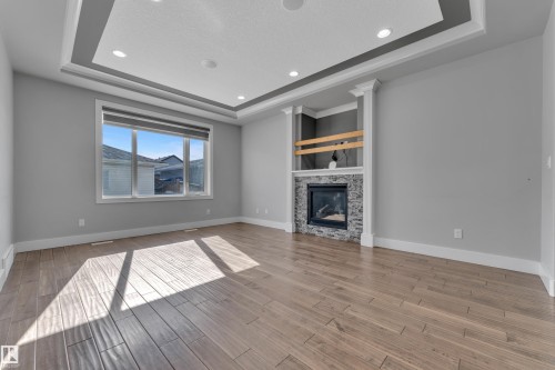2615 21 Avenue, Edmonton, AB - Indoor Photo Showing Living Room With Fireplace